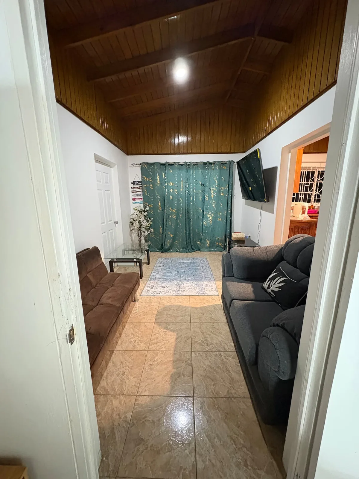 Living room with a sofa and futon in Ocean View Villa