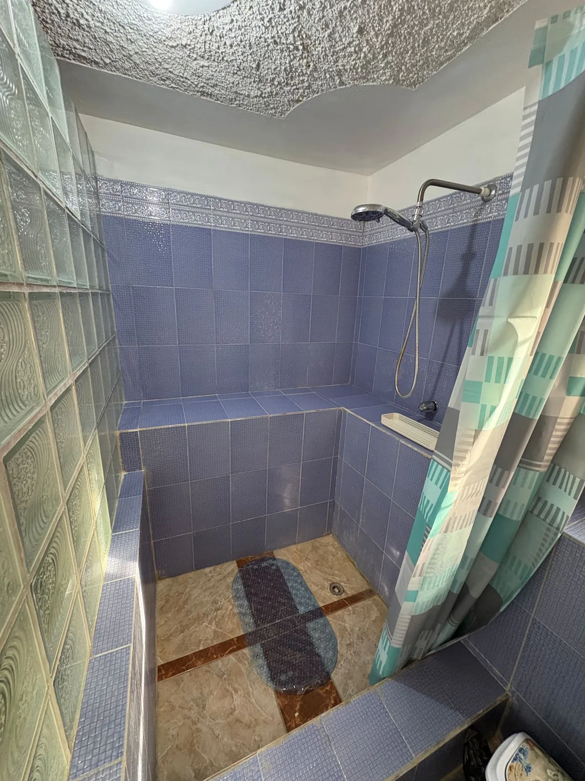 Blue tiled shower in Sea View Villa