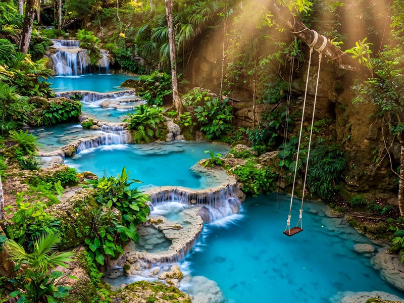 Turquoise pools and cascades of Blue Hole winding through jungle above Ocho Rios