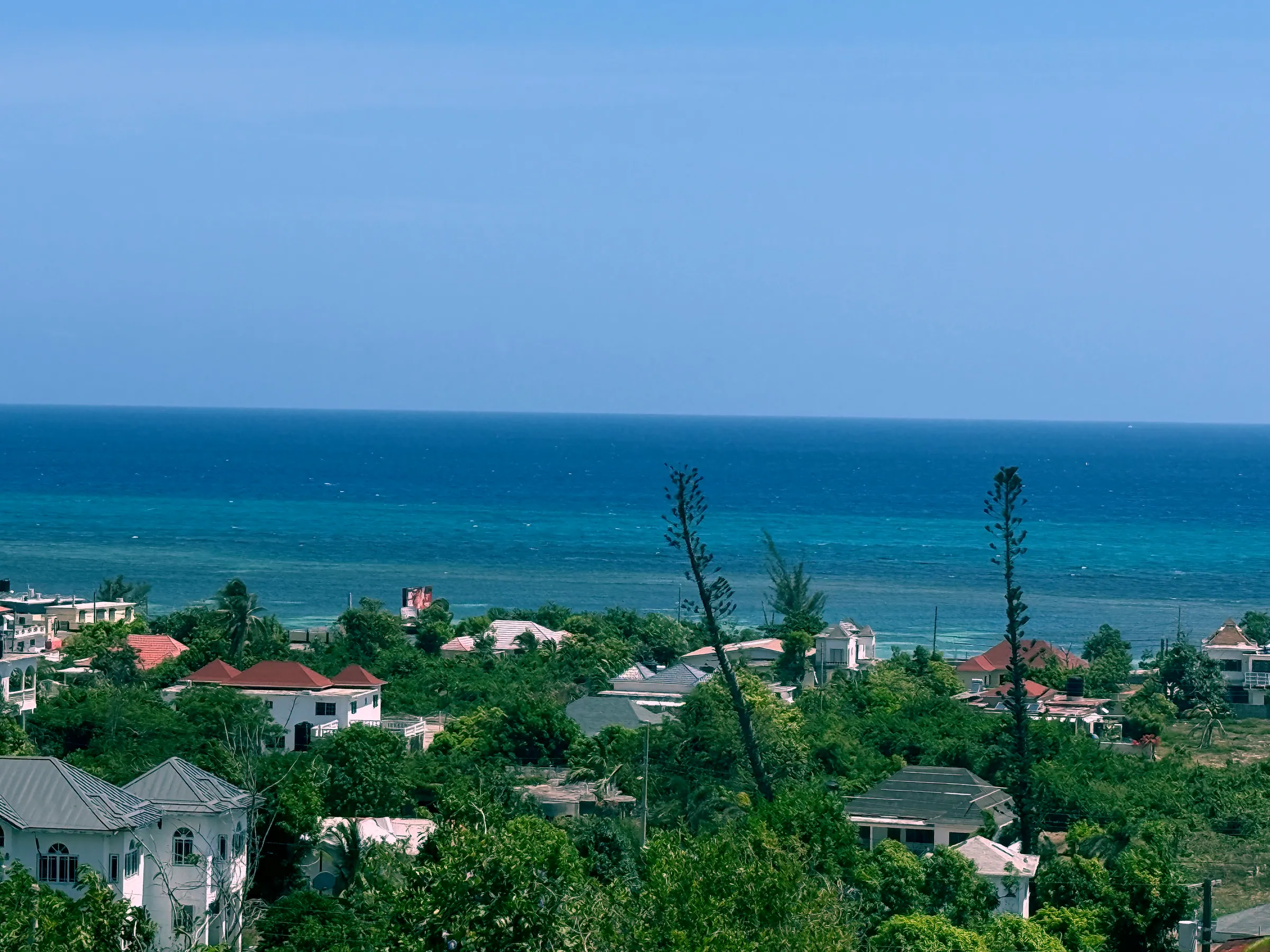 The sea, the reef and the rooftops of Wiltshire from the hill